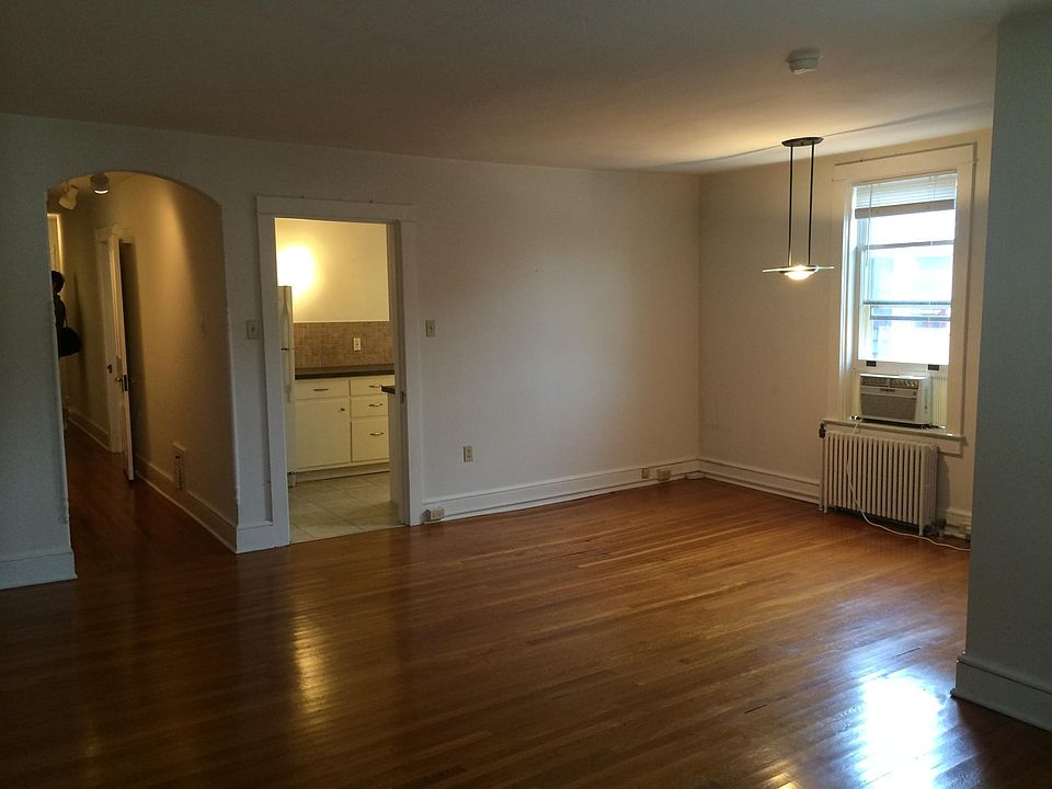 Living room looking into kitchen and hall to bedrooms