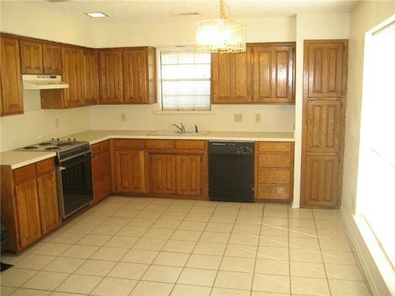 New granite counters and backsplash being installed in the k