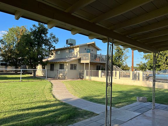 looking out the patio door to the apt .