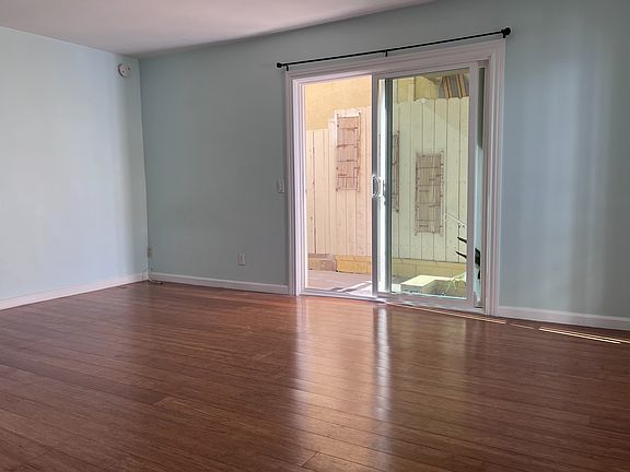 Spacious living area. Outside is the private patio and secure entrance.