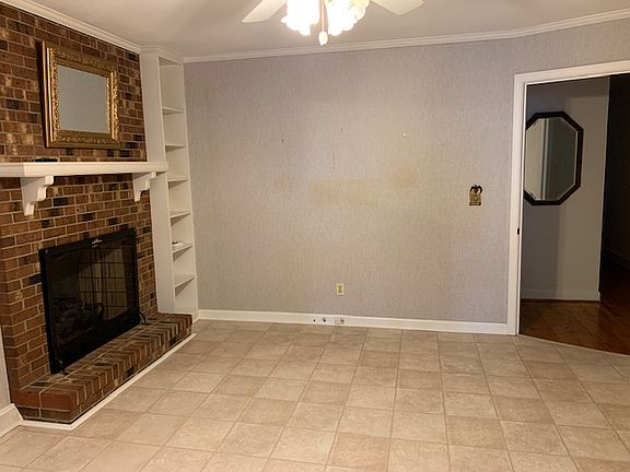 Den with fireplace

