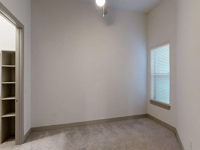 Spacious apartment Bedroom with Carpet Floor.