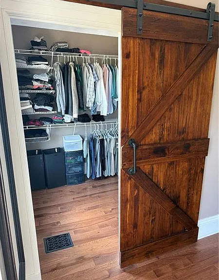 Walk-in closet in primary bedroom.