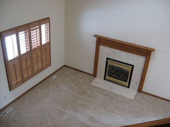 Vaulted ceilings, plantation shutters throughout, new carpet, gas fireplace