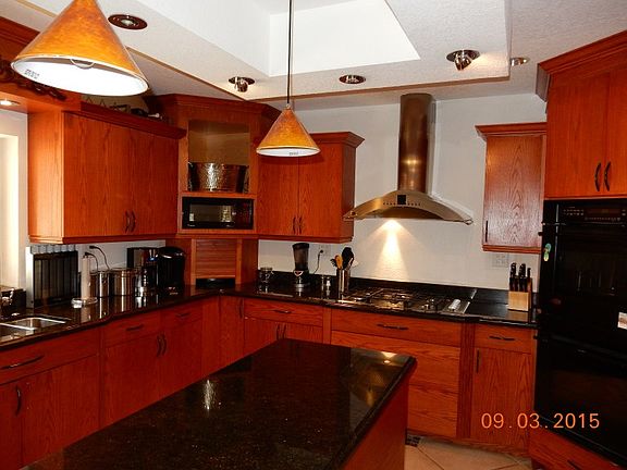 Kitchen with SS applainces, granite counters, wood cabinets