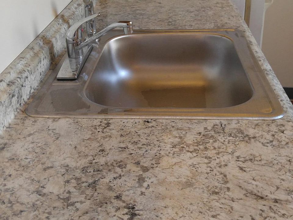 Newer kitchen counter and sink and faucet