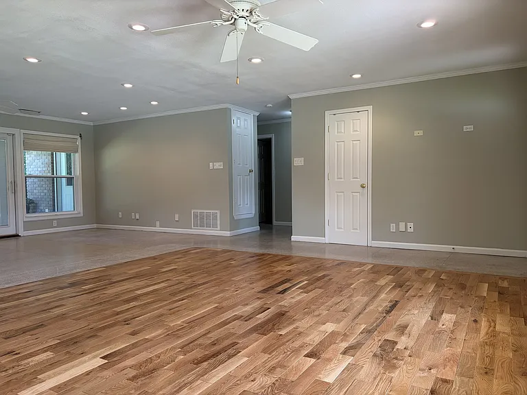 Spacious front living/flex room with beautiful hardwood flooring.
