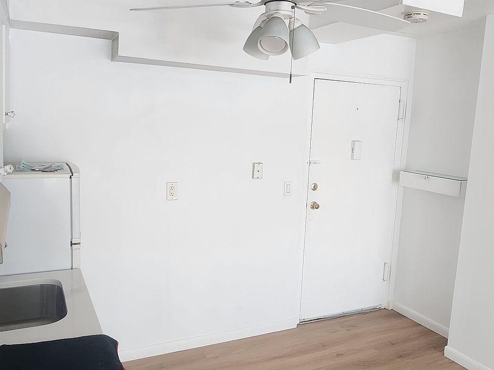 view of kitchenette and entry door