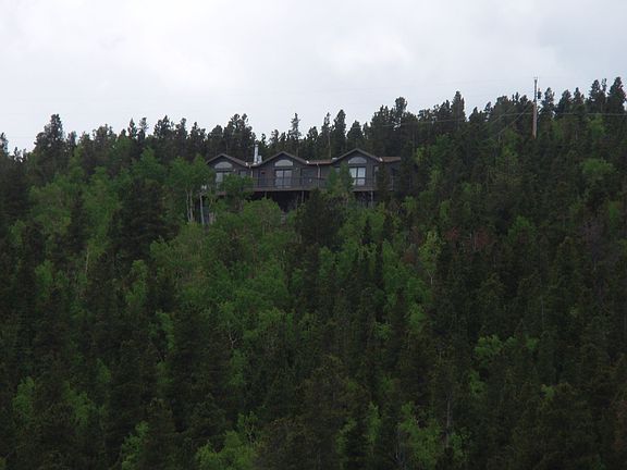 House from distance...On top of mountain.