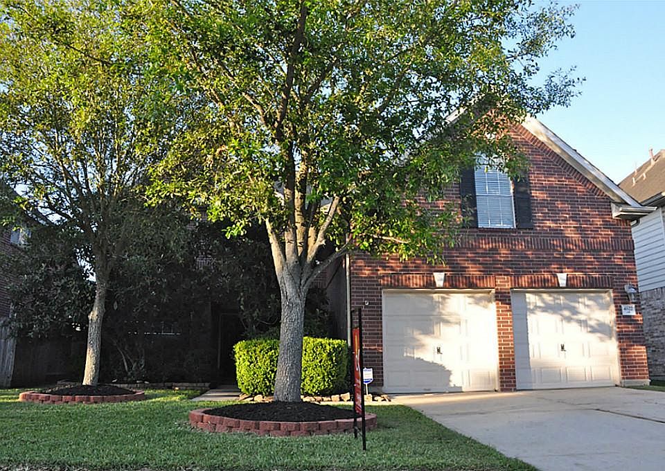 Beautiful curb appeal with professional landscaping.