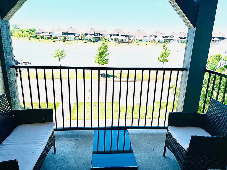 Private front balcony with a serene lake view