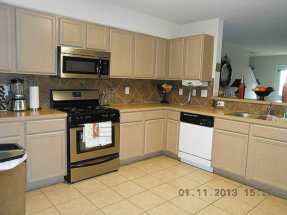 Large kitchen, opens to living room and formal dinning room. Great upgrades
