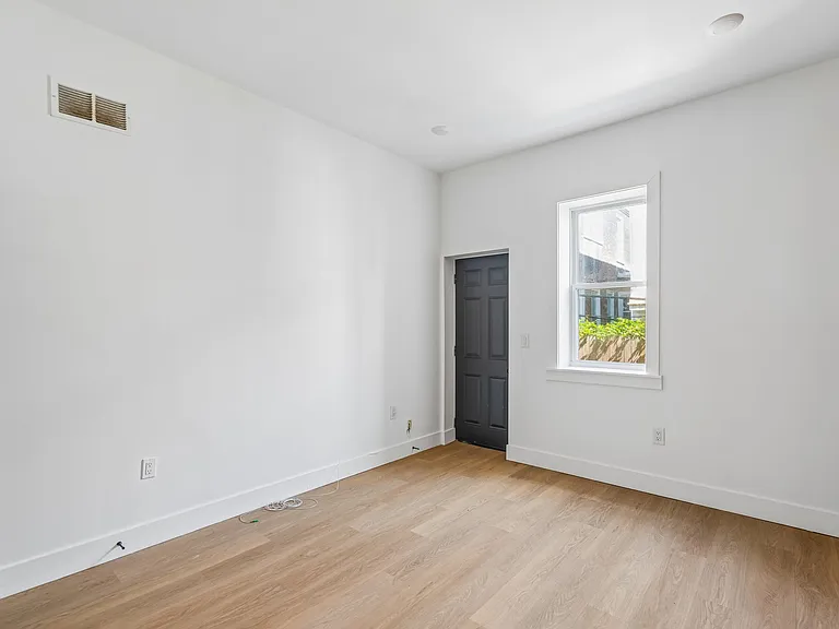 Bedroom with door to private yard