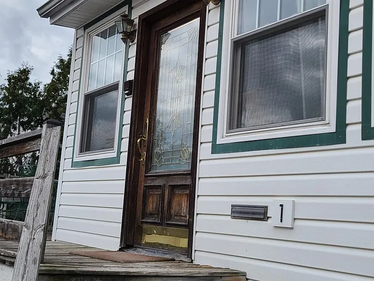 Entrance Door (1 of 2) Closest to Driveway