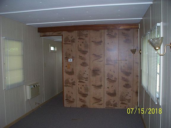 Living room. New blinds throughout. A/c on left