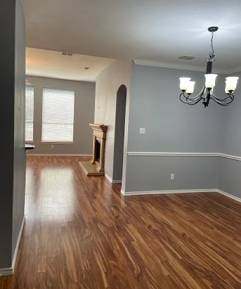 Formal dining room leads into living room area.
