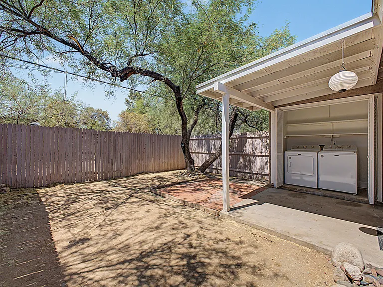 Washer/Dryer in rear patio area.