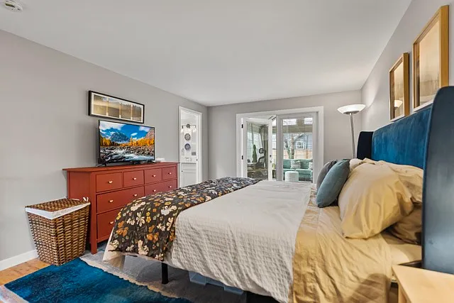 Master bedroom with king bed and attached bathroom