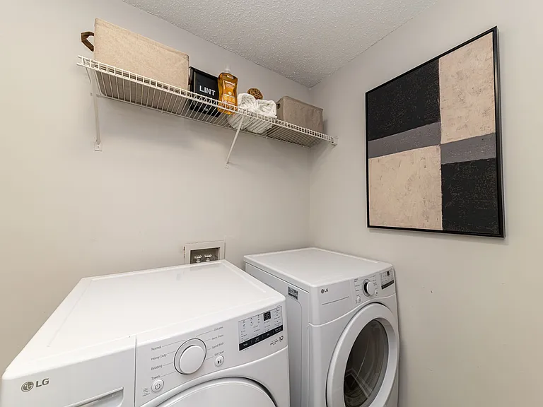 Laundry room with built-in shelving