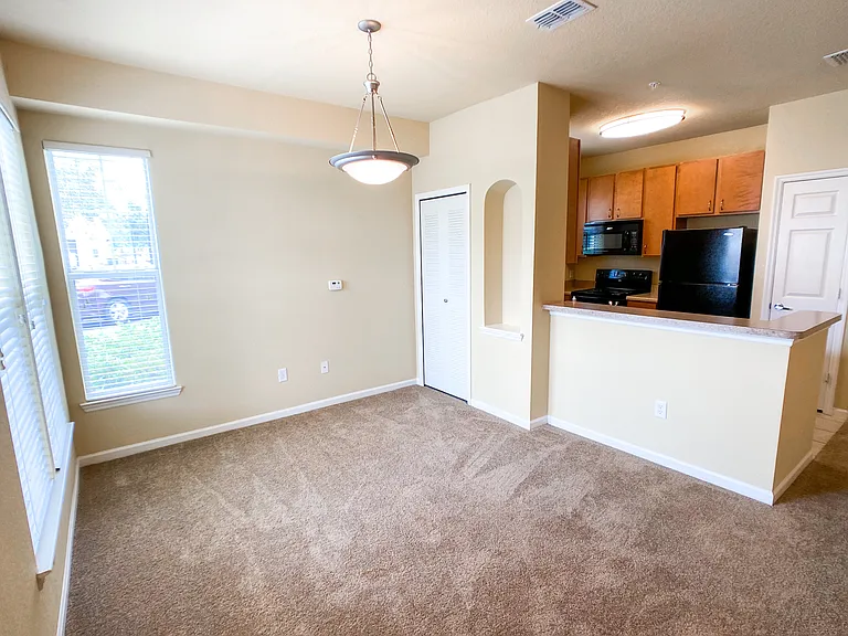 Open Concept Design with Lush Carpet in Living and Dining Rooms Open Concept Design with Lush Carpet in Living and Dining Rooms