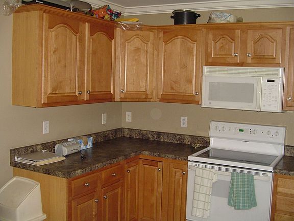 Beautiful hardwood cabinetry, and a ceramic tiled floor