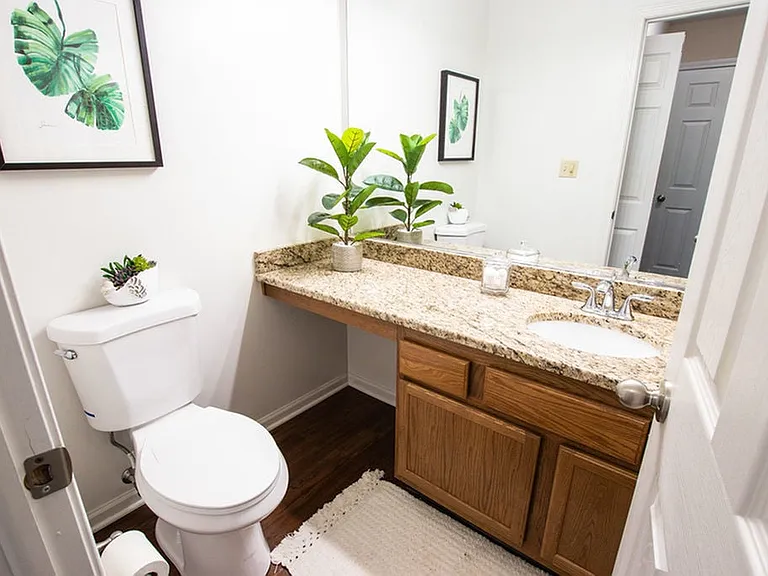 Half Bathroom with Granite Countertops and New Fixtures