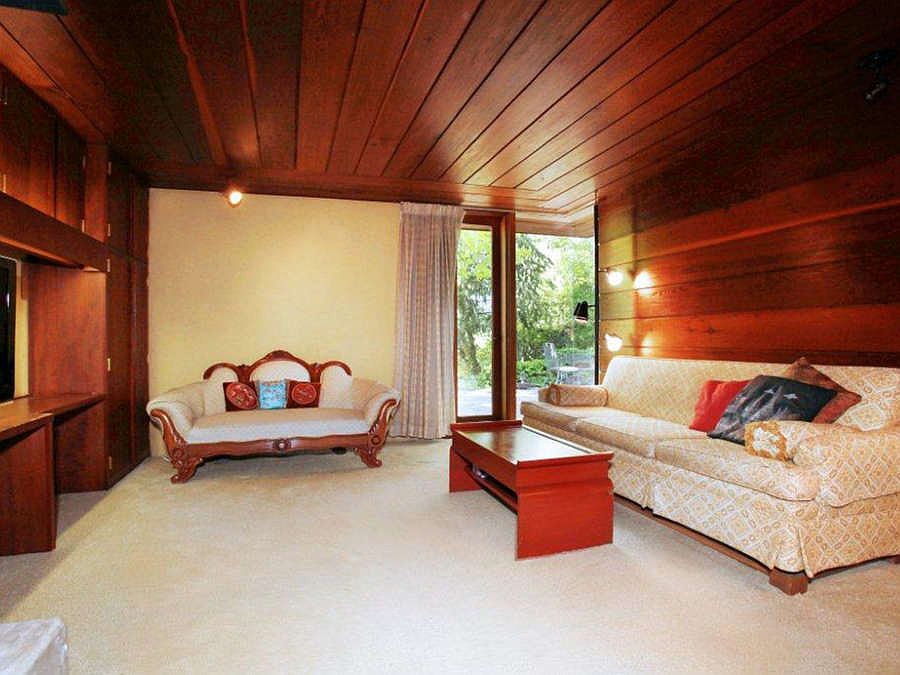 "2nd bedroom with built-in cabinets, wood burning fireplace and walks out to the patio area"