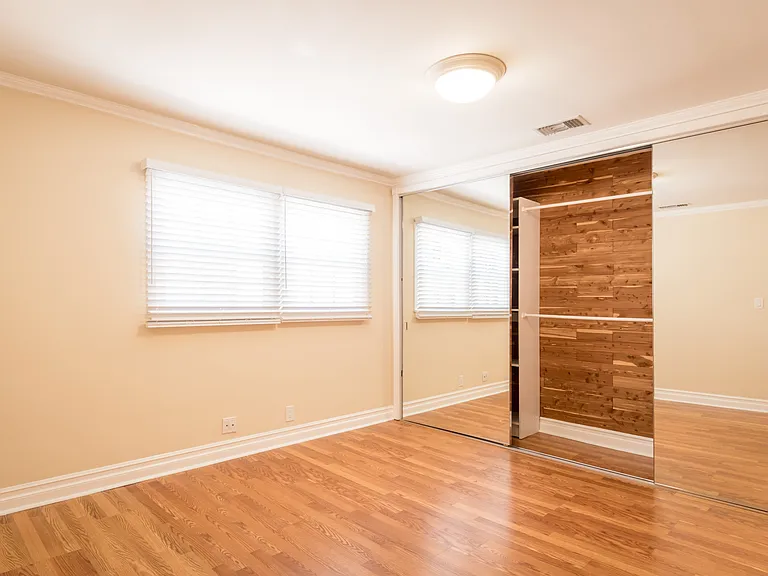 SECOND BEDROOM HAS CEDARED LINED LARGE MIRRORED CLOSET