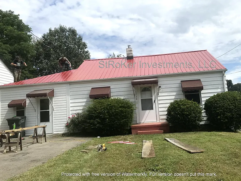 Putting on a new metal roof.