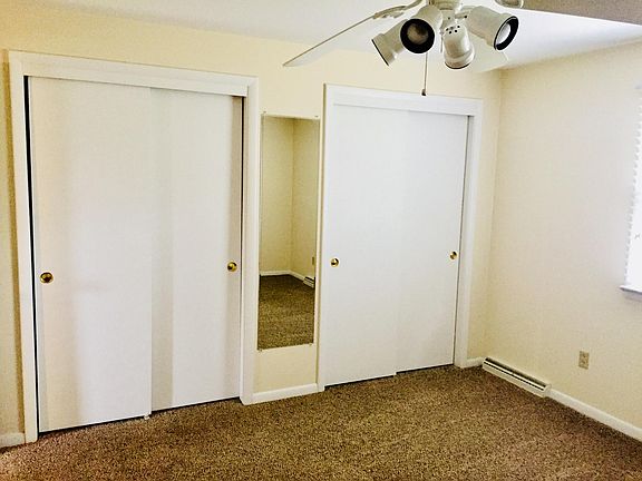 Master bedroom neutral colors with 2 large closets and ceili