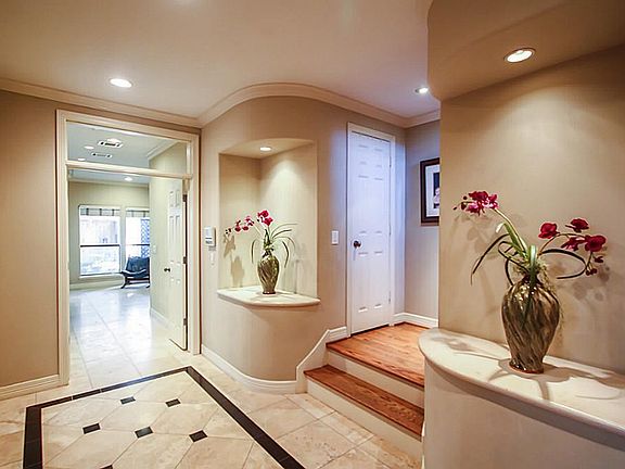 Impressive 13 foot wide foyer opens into the over-sized 3rd bedroom and goes up to the 2nd floor liv