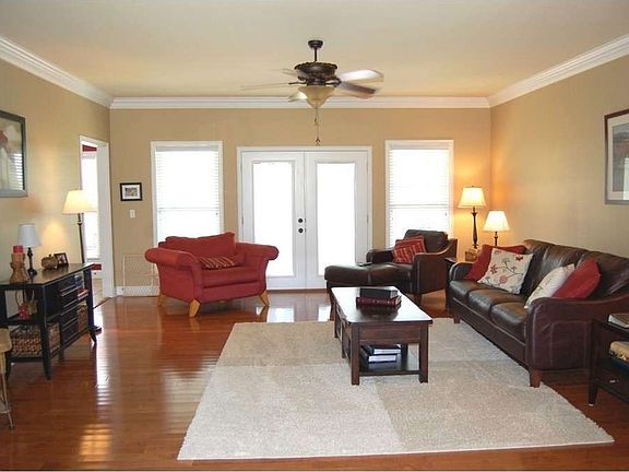 "The spacious living room opens to the large covered porch"