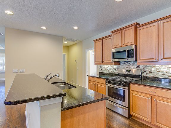Glass tile back splash.