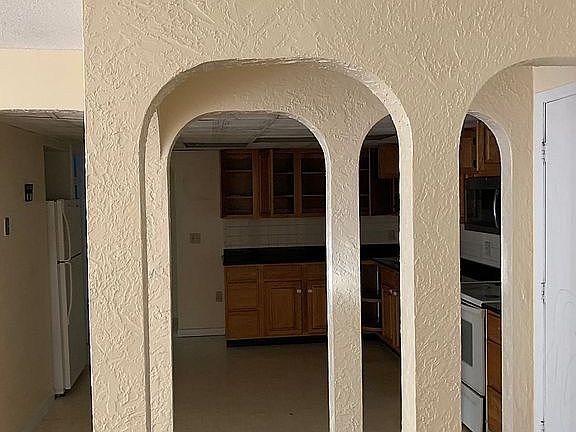 Condo entry facing kitchen 