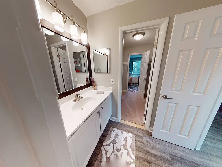 Framed vanity with upscale vanity lighting