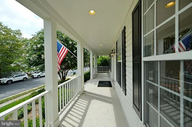 The front porch gets beautiful sunshine and light! - 43305 Atherton St