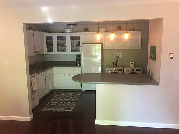 Kitchen with counter seating and in-unit washer and dyer!