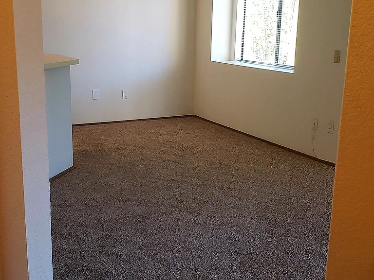 Dining room with fan and window