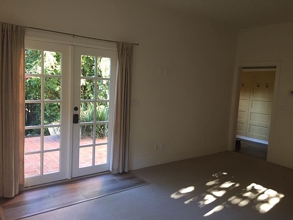 beautiful living room with wool carpet & access to patio