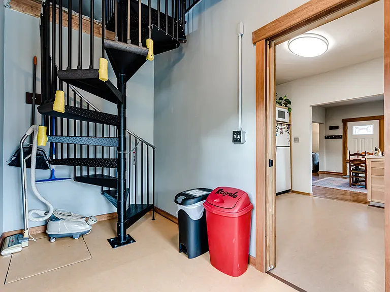 Spiral staircase leads to bedroom 3.