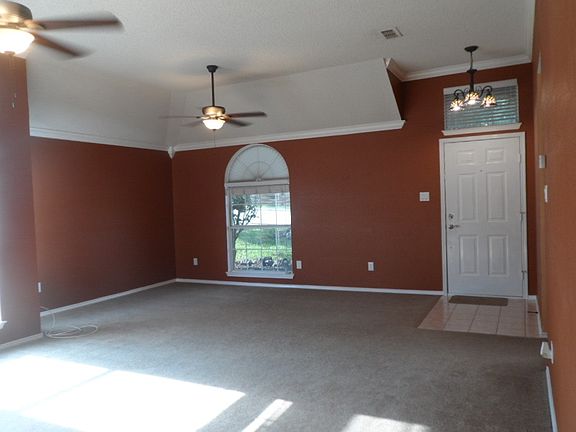 Front family room/parlor with tiffany style entry lamp.