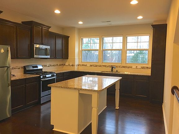 New stainless steel appliances and generous storage
