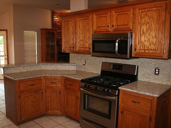 New stainless steel gas range and microwave.