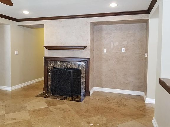 Gas fireplace in dining room with media connections in the area to the right of the fireplace.