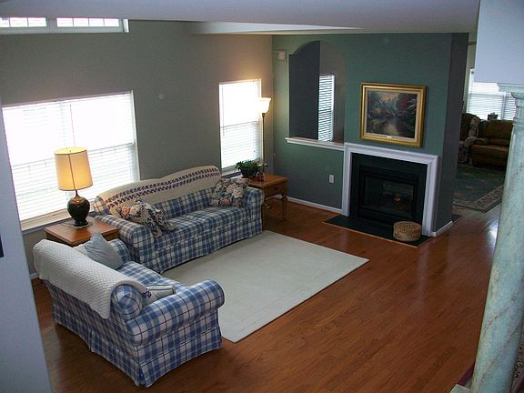 Living Room with Cathedral Ceiling and Fireplace
