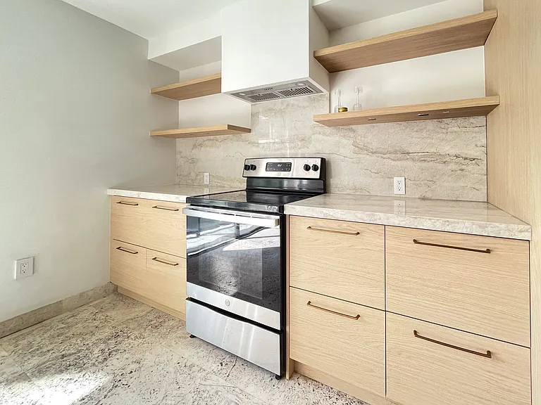 Brand new kitchen with custom cabinets and Taj Mahal countertops