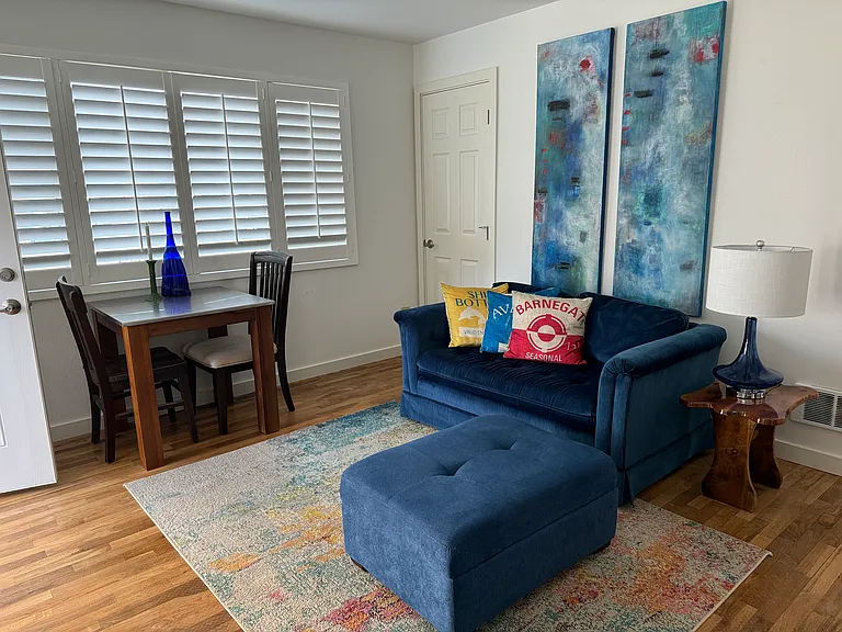 Living area showing view of dining and couch area.