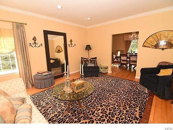 Spacious living room opens to formal dining room.  Gleaming hardwood floors.