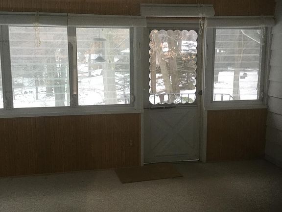 Back porch, covered & carpeted, no heat, good storage area Off season, windows with screens,