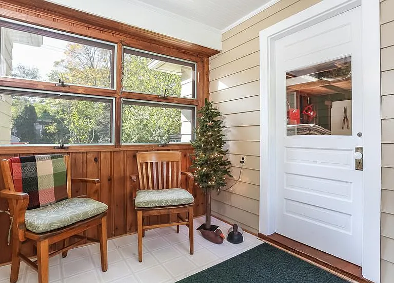 This charming breezeway connects the garage and house and is the perfect place to change from streets shoes to slippers and switch into relaxation mode.